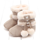 Chaussons à pompon pour bébé