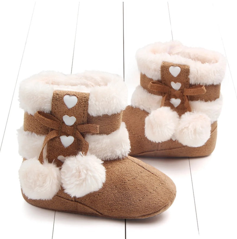 Chaussons à pompon pour bébé